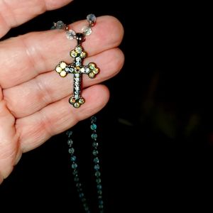 Chain with beads and across at the end with different colored stones